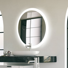 The Trinity Lighted Mirror from Electric Mirror in an office bathroom.