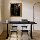 The Bok Adjustable Desk Black Oak from Ethnicraft in a dining area.