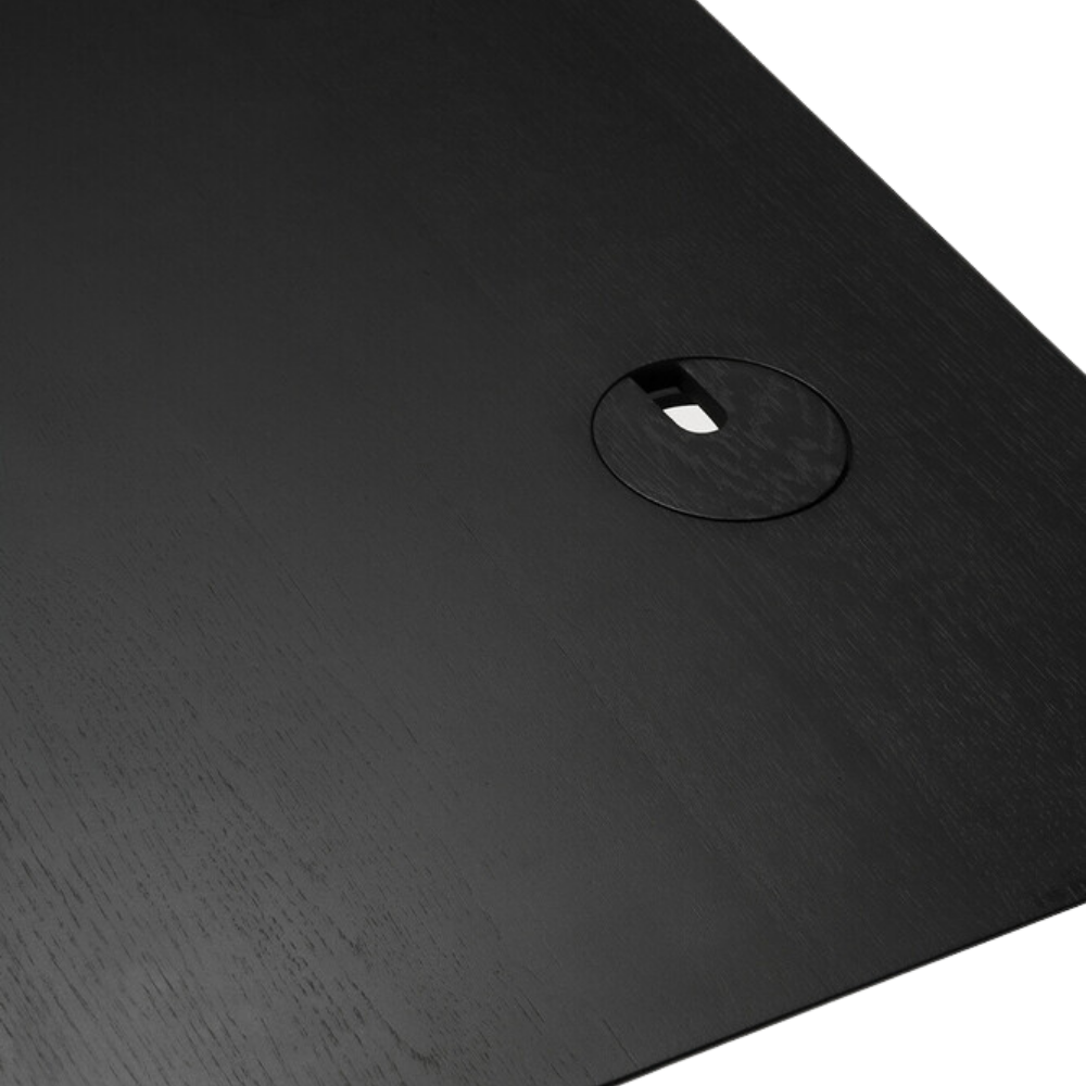 The Bok Adjustable Desk in black from Ethnicraft, with the details of the tabletop.