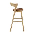 The Bok Upholstered Bar Stool by Ethnicraft from the side.