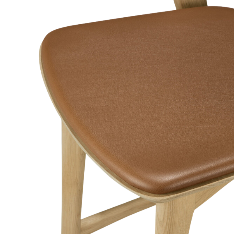 The Bok Upholstered Bar Stool by Ethnicraft seat in leather in detail.