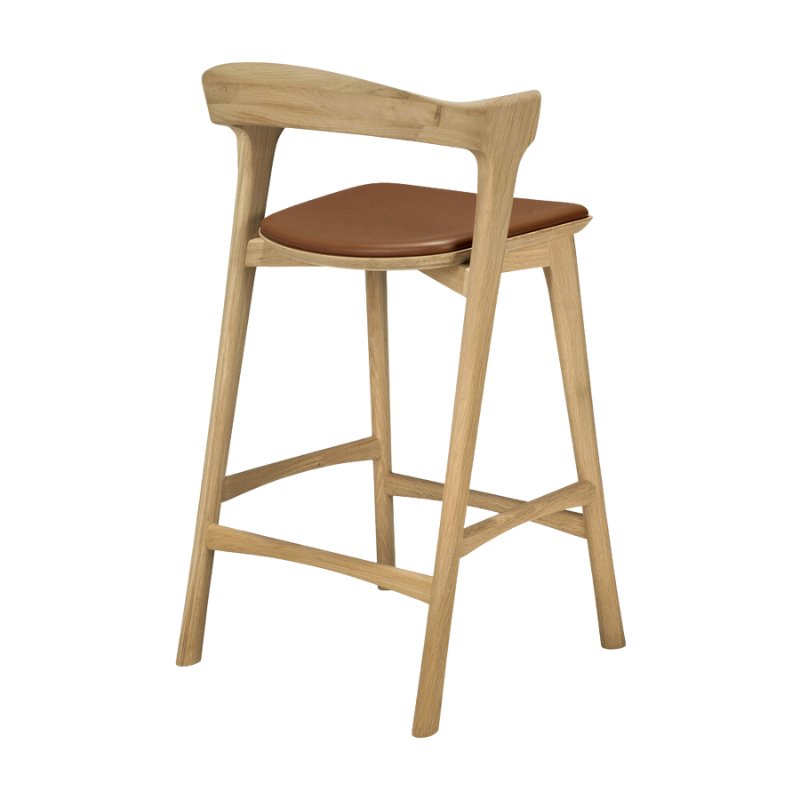 The Bok Upholstered Counter Stool from Ethnicraft from the back at an angle.