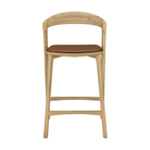 The Bok Upholstered Counter Stool from Ethnicraft from the front.