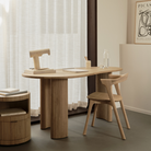 The Boomerang Drawer Unit Oak by Ethnicraft in a living room.