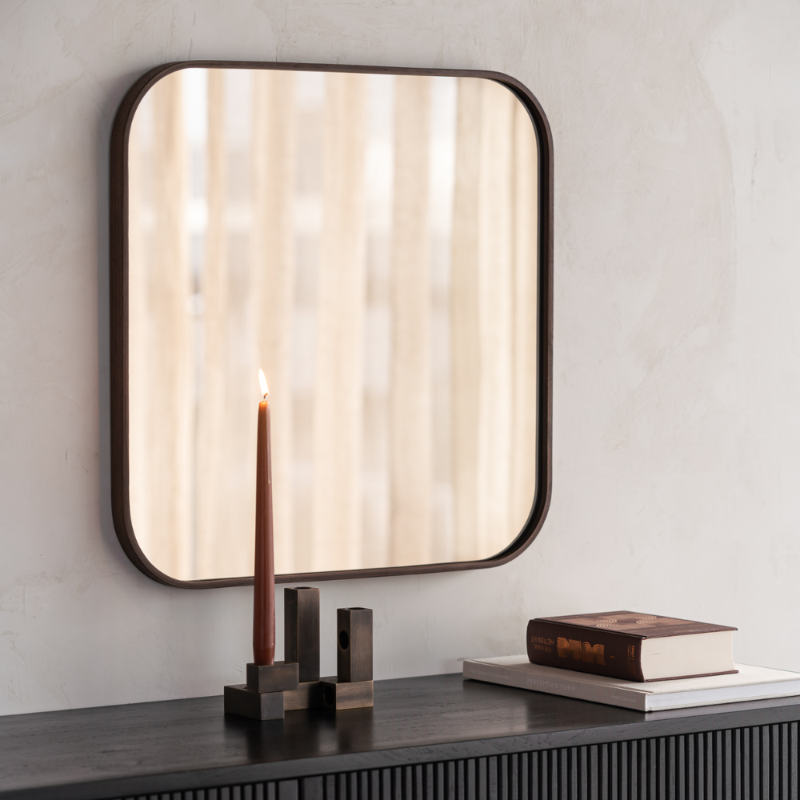 The Camber Wall Mirror from Ethnicraft in a living room.