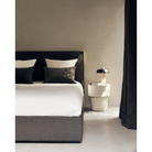 The Elements Mushroom Side Table from Ethnicraft in a primary bedroom.