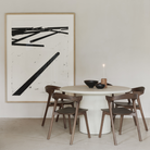 The 49-inch Elements Round Dining Table from Ethnicraft is in a dining room.