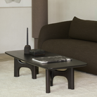 The Flow Coffee Table from Ethnicraft in a family area.