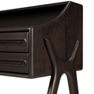 The Flow Desk by Ethnicraft is in rose brown mahogany, showing a leg and drawers.