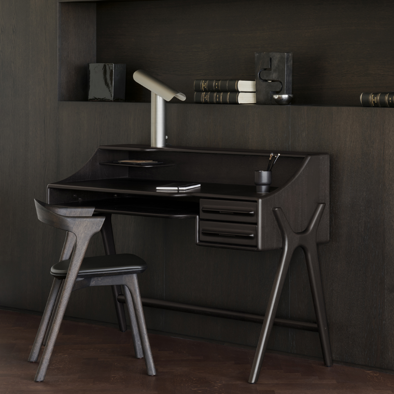 The Flow Desk by Ethnicraft in rose brown mahogany in a study room.