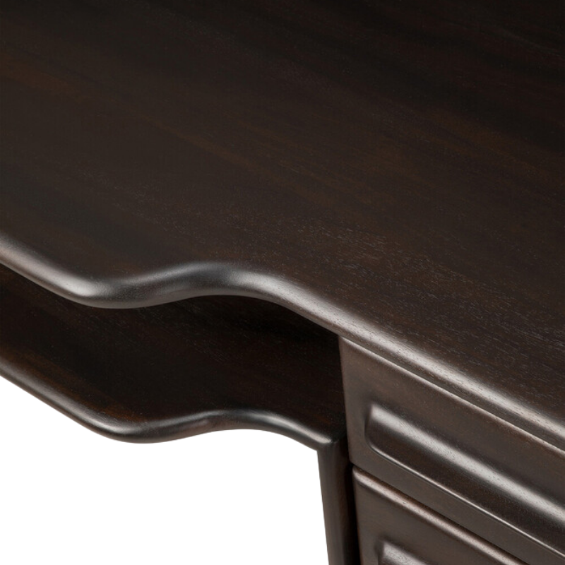 The Flow Desk by Ethnicraft in rose brown mahogany from top with a curved design.