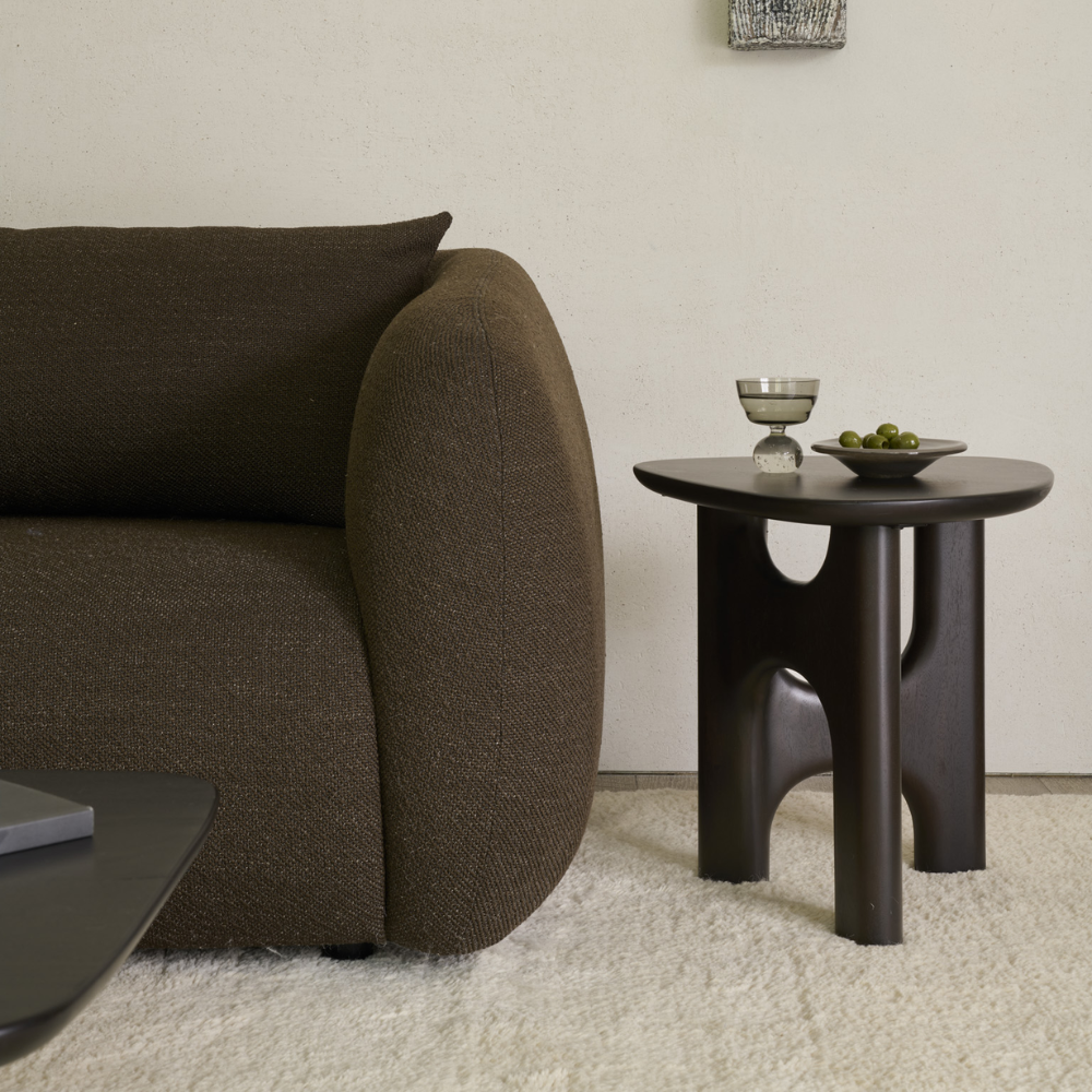 The Flow Side Table from Ethnicraft in a living room.