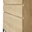 The Stairs Cupboard by Ethnicraft with a close-up from the side corner of the cupboard.