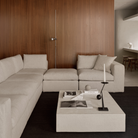 The Mellow Footstool Ivory from Ethnicraft in a living room.