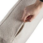 The Mellow Footstool Ivory from Ethnicraft, opens up the zip.