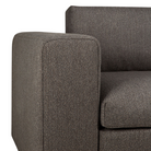 The Mellow Sofa in Granite from Ethnicraft with a close-up of the armrest.