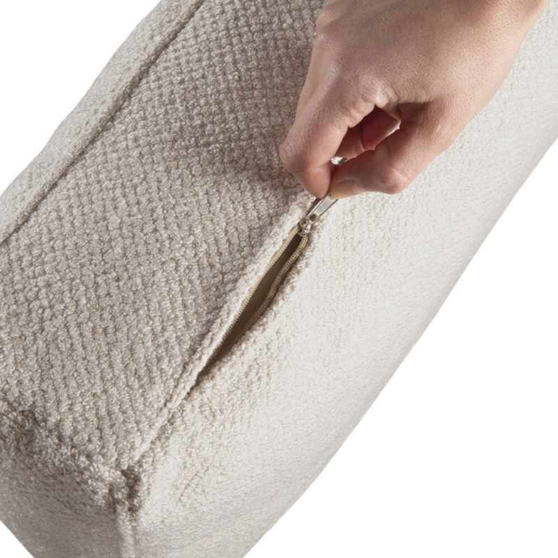 The Mellow Sofa Set, Square 2-3 Ivory from Ethnicraft, opens up the zip of the covers.