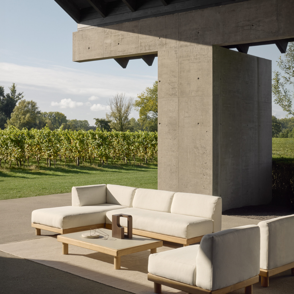 The Monocle Outdoor Sofas Collection from Ethnicraft in a garden area. all-groups