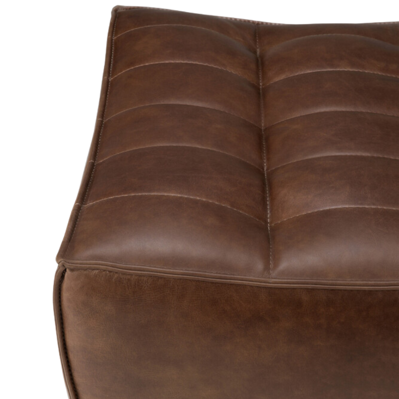 The N701 Leather Footstool Chestnut by Ethnicraft with a close-up.