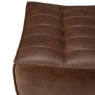 The N701 Leather Footstool Chestnut by Ethnicraft with a close-up.