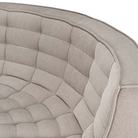 The N701 Modular Round Corner Sofa from Ethnicraft with ecru eco fabric showing the round corner close up.