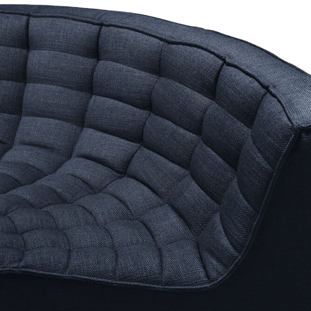 The N701 Modular Round Corner Sofa from Ethnicraft with graphite eco fabric focusing on the round corner.
