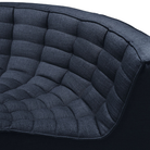 The N701 Modular Round Corner Sofa from Ethnicraft with graphite eco fabric focusing on the round corner.