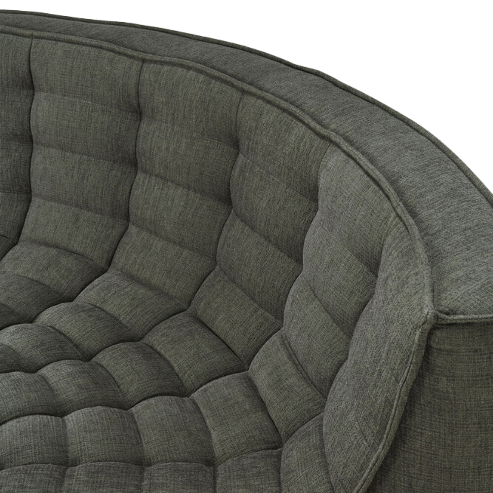 The N701 Modular Round Corner Sofa from Ethnicraft with moss eco fabric highlighting the round corner.