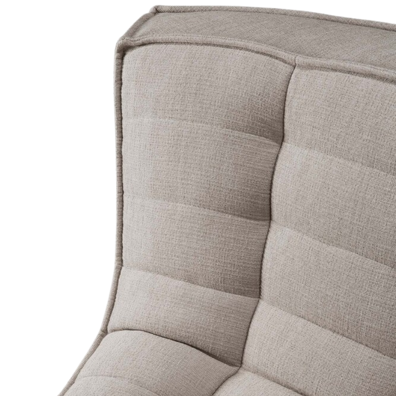 The round corner from the N701 Modular Sectional Sofa, Round 1-2 from Ethnicraft in Ecru eco fabric close up.