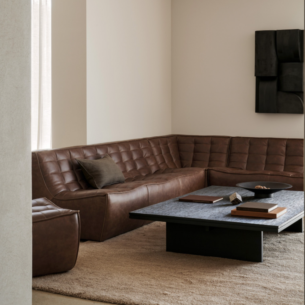 The N701 Modular Sofa from Ethnicraft with chestnut aniline leather in a living area.