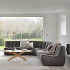 The N701 Modular Sofa from Ethnicraft with dark gray standard fabric in a family area.