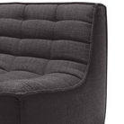 The N701 Modular Sofa from Ethnicraft with dark gray standard fabric focusing on the seat in detail.