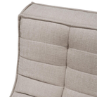 The N701 Modular Sofa from Ethnicraft with ecru eco fabric focusing on the stitching.