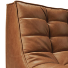 The N701 Modular Sofa from Ethnicraft with old saddle aniline leather focusing on the back rest