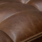 The N701 Round Leather Footstool from Ethnicraft with a close-up of the seat.