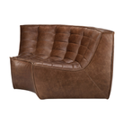 The N701 Round Leather Footstool by Ethnicraft from the side angle.