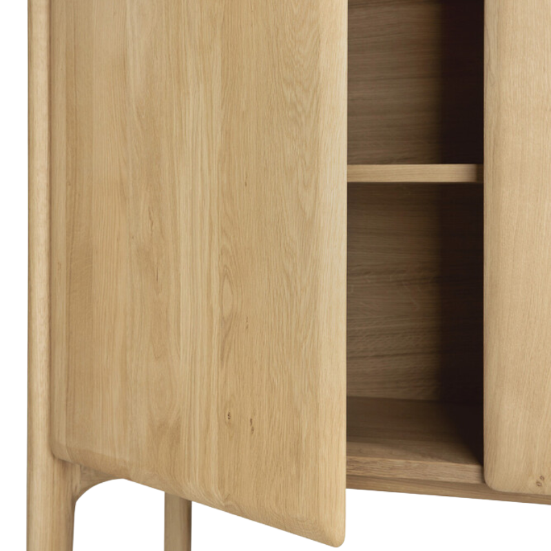 The Oak PI Cupboard by Ethnicraft with an open door showing good storage space.