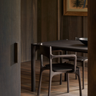 The PI Dining Chair with Armrest by Ethnicraft in the dining room.