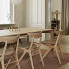 The Oak PI Dining Table by Ethnicraft in a dining room. all-groups