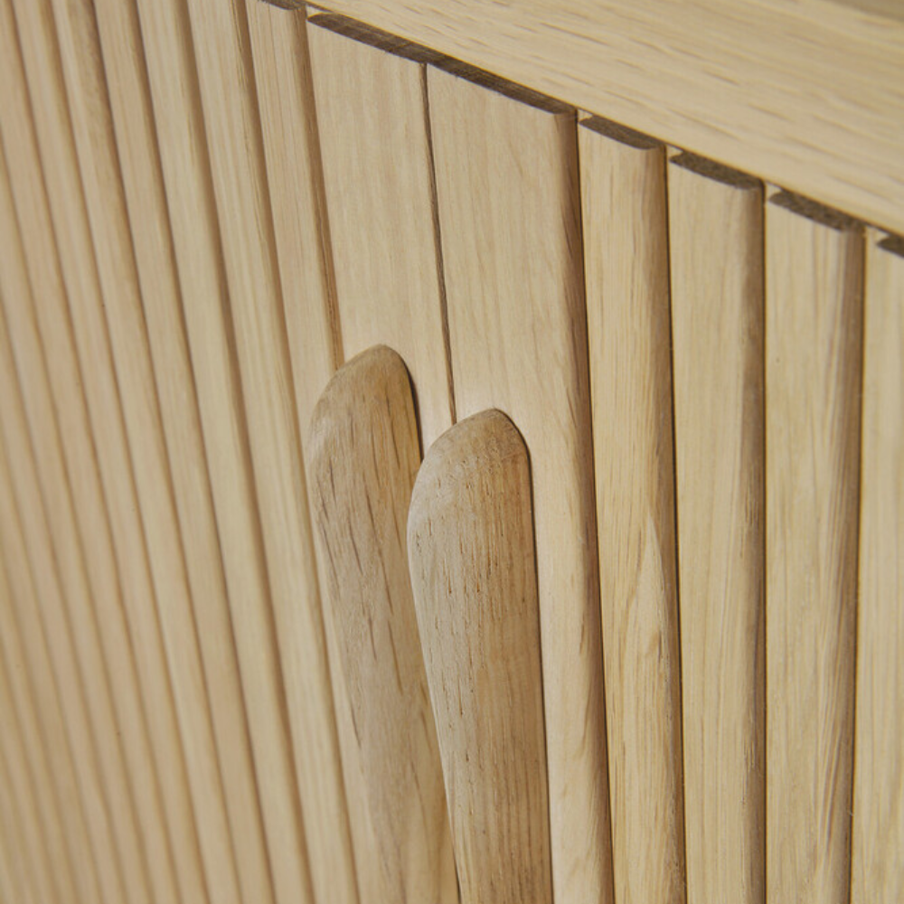 Door handle detail of the 66-inch Roller Max Sideboard from Ethnicraft in oak.