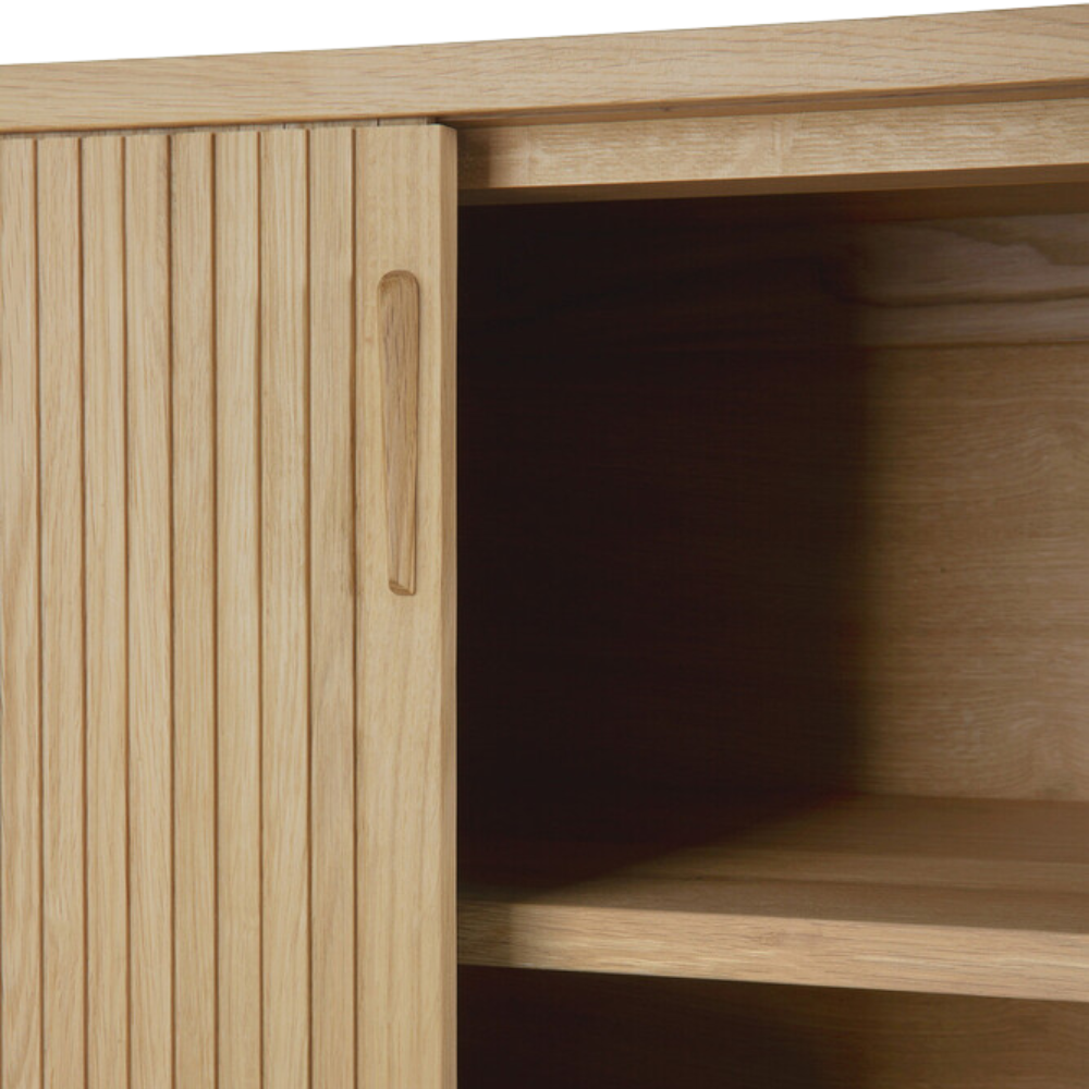 Open door detail of the 66-inch Roller Max Sideboard from Ethnicraft in oak.