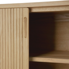 Open door detail of the 66-inch Roller Max Sideboard from Ethnicraft in oak.