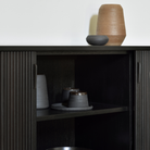 The Roller Max Sideboard from Ethnicraft in teak off black with ceramics inside.