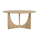 The oak Round Geometric Dining Table from Ethnicraft at an angle.