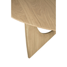 The oak Round Geometric Dining Table from Ethnicraft focusing on the tabletop.