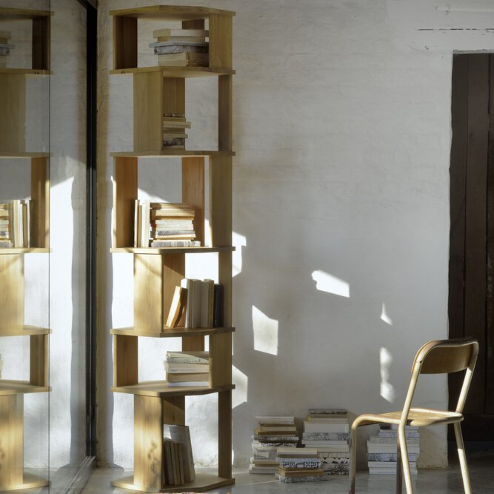 The Stairs Column Oak from Ethnicraft in a study room.