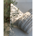 The Stripes Outdoor Cushion from Ethnicraft in an outdoor living space.