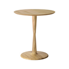The Torsion Round Dining Table Oak, 27.5-inches by Ethnicraft.
