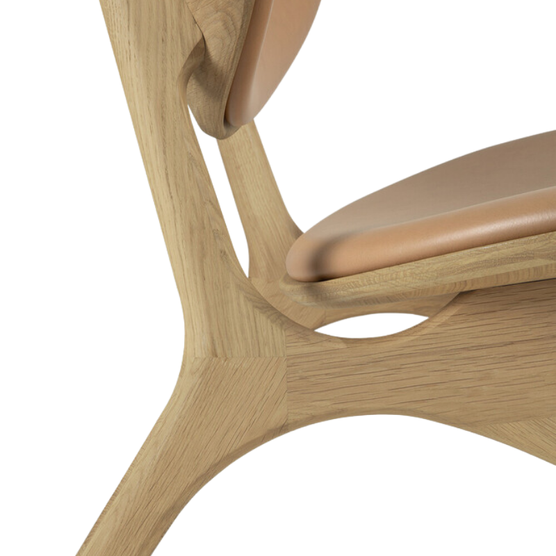 The Upholstered Eye Lounge Leather Chair by Ethnicraft with the close-up of the frame.
