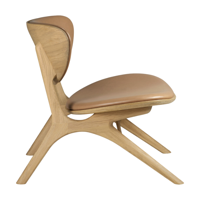 The Upholstered Eye Lounge Leather Chair by Ethnicraft from side angle.